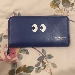 Long royal blue wallet with eyes.